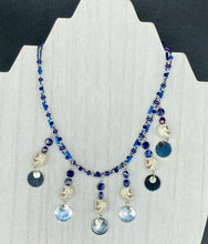 Load image into Gallery viewer, Stunning Cascade of Edgy Gun Metal Shimmery Glass Bead Necklace. Contains six dangling strands of beautiful and bold skulls and glass beads. A variety of shapes and different color glass beads are used that contain hues of silver, purple, pink, blue, and gold tones. This bold and beautiful necklace comes with dainty matching earrings to complete the look. Measurements: Necklace is 14 1/2” adjustable up to 18" - each glass skulls measures 1 3/4” in Height