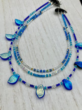 Load image into Gallery viewer, This exquisite Winter Frost Nature Inspired Jewelry has all your style needs covered. A detailed, glass beaded necklace featuring an array of blues, silver and gold tones adorns your neck to add a touch of elegance to any look. Effortlessly dress it up or down to complement any ensemble. Measurements: Necklace is 14” in length, can be adjusted up to 18"