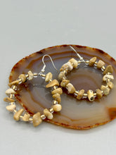 Load image into Gallery viewer, These Natural Bamboo chip and Clear with Gold Glass Beaded Hoop Earrings are a chic combination of neutral colors for versatility, allowing for a unique look whether dressed up or down. Measurements: 1 1/2" length