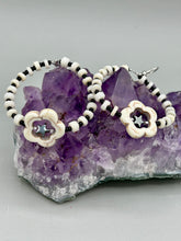 Load image into Gallery viewer, These handcrafted bohemian earrings combine an eye-catching white magnesite flower bead with a tiny hematite star bead, all charmingly displayed in a bone and glass beaded hoop. Perfect for adding a touch of hippie, shabby chic or boho chic vibes to your style. Measurements: 2" length