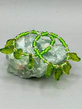 Load image into Gallery viewer, Light green glass leaf beaded earrings are intricately designed, making them ideal for styling in all seasons. Measurements: Earrings: 2 1/4" length