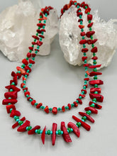 Load image into Gallery viewer, This eye-catching Southwestern Style necklace features two strands of alternating red coral and turquoise-tone glass beads, including both petite and larger sizes. Measurements: Necklace is 17" in length adjustable to 19"