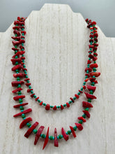 Load image into Gallery viewer, This eye-catching Southwestern Style necklace features two strands of alternating red coral and turquoise-tone glass beads, including both petite and larger sizes. Measurements: Necklace is 17" in length adjustable to 19"