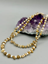 Load image into Gallery viewer, This natural bamboo, bone, and gold glass beaded necklace is the perfect piece to add versatility to any outfit. The neutral colors blend easily with any look and will give your outfit an unforgettable look. Measurements: Necklace: 15" - can be adjusted up to 16"