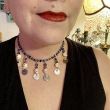 Load image into Gallery viewer, Stunning Cascade of Edgy Gun Metal Shimmery Glass Bead Necklace. Contains six dangling strands of beautiful and bold skulls and glass beads. A variety of shapes and different color glass beads are used that contain hues of silver, purple, pink, blue, and gold tones. This bold and beautiful necklace comes with dainty matching earrings to complete the look. Measurements: Necklace is 14 1/2” adjustable up to 18" - each glass skulls measures 1 3/4” in Height