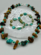 Load image into Gallery viewer, Bold earthy tone necklace contains large natural tigers eye stone chips with blue and green turquoise glass beads. Measurements: Necklace is 18 3/4 " in length adjustable to 20"