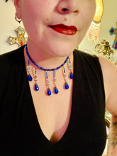 Load image into Gallery viewer, This Victorian Gothic Cobalt Blue Glass Beaded Choker Style Necklace is a true showstopper, with vibrant blue adjustable collar style glass beading and bright dark blue tear drop glass beads. Rainbow hematite beads are added to create a complex and visually-appealing combination of shapes and colors. Necklace is 14” adjustable up to 18" Victorian Goth, Fairy Winter Wonderland