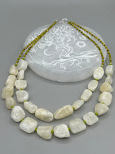 Load image into Gallery viewer, This exquisite necklace features large natural Calcite beads complemented by Wasabi Green glass beads. Two strands of neutral colors bring a sophisticated look that can dress up or dress down any outfit for a one-of-a-kind style. Measurements: Necklace is 17 1/4 " in length adjustable to 18 1/2"