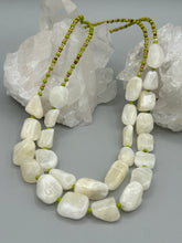 Load image into Gallery viewer, This exquisite necklace features large natural Calcite beads complemented by Wasabi Green glass beads. Two strands of neutral colors bring a sophisticated look that can dress up or dress down any outfit for a one-of-a-kind style. Measurements: Necklace is 17 1/4 " in length adjustable to 18 1/2"