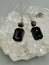 Load image into Gallery viewer, Elegantly crafted from black rectangular and circular glass beads, these dainty earrings offer a versatile style that can effortlessly elevate any ensemble. Measurements: 1 3/8” in length
