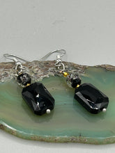 Load image into Gallery viewer, Elegantly crafted from black rectangular and circular glass beads, these dainty earrings offer a versatile style that can effortlessly elevate any ensemble.  Measurements: 1 3/8” in length