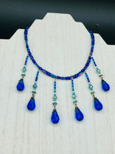 Load image into Gallery viewer, This Victorian Gothic Cobalt Blue Glass Beaded Choker Style Necklace is a true showstopper, with vibrant blue adjustable collar style glass beading and bright dark blue tear drop glass beads. Rainbow hematite beads are added to create a complex and visually-appealing combination of shapes and colors. Necklace is 14” adjustable up to 18" Victorian Goth, Fairy Winter Wonderland