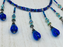 Load image into Gallery viewer, This Victorian Gothic Cobalt Blue Glass Beaded Choker Style Necklace is a true showstopper, with vibrant blue adjustable collar style glass beading and bright dark blue tear drop glass beads. Rainbow hematite beads are added to create a complex and visually-appealing combination of shapes and colors. Necklace is 14” adjustable up to 18" Victorian Goth, Fairy Winter Wonderland