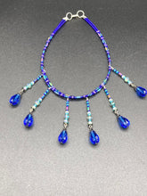 Load image into Gallery viewer, This Victorian Gothic Cobalt Blue Glass Beaded Choker Style Necklace is a true showstopper, with vibrant blue adjustable collar style glass beading and bright dark blue tear drop glass beads. Rainbow hematite beads are added to create a complex and visually-appealing combination of shapes and colors. Necklace is 14” adjustable up to 18" Victorian Goth, Fairy Winter Wonderland