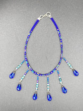 Load image into Gallery viewer, This Victorian Gothic Cobalt Blue Glass Beaded Choker Style Necklace is a true showstopper, with vibrant blue adjustable collar style glass beading and bright dark blue tear drop glass beads. Rainbow hematite beads are added to create a complex and visually-appealing combination of shapes and colors. Necklace is 14” adjustable up to 18" Victorian Goth, Fairy Winter Wonderland