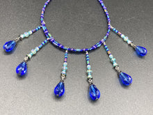 Load image into Gallery viewer, This Victorian Gothic Cobalt Blue Glass Beaded Choker Style Necklace is a true showstopper, with vibrant blue adjustable collar style glass beading and bright dark blue tear drop glass beads. Rainbow hematite beads are added to create a complex and visually-appealing combination of shapes and colors. Necklace is 14” adjustable up to 18" Victorian Goth, Fairy Winter Wonderland