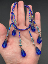 Load image into Gallery viewer, This Victorian Gothic Cobalt Blue Glass Beaded Choker Style Necklace is a true showstopper, with vibrant blue adjustable collar style glass beading and bright dark blue tear drop glass beads. Rainbow hematite beads are added to create a complex and visually-appealing combination of shapes and colors. Necklace is 14” adjustable up to 18" Victorian Goth, Fairy Winter Wonderland