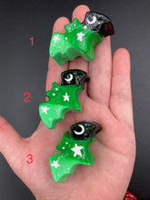 Load image into Gallery viewer, Cute and spooky magnet design to adorn your refrigerator, lockers, workstation, toolbox, or dishwasher. This hand-sculpted clay bat statuette boasts stunning ombre coloration, transitioning from black to dark green to light green to recreate the breathtaking look of a starry night sky. H 1” x W 2” x D 1/2”