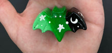 Load image into Gallery viewer, Cute and spooky magnet design to adorn your refrigerator, lockers, workstation, toolbox, or dishwasher. This hand-sculpted clay bat statuette boasts stunning ombre coloration, transitioning from black to dark green to light green to recreate the breathtaking look of a starry night sky. H 1” x W 2” x D 1/2”