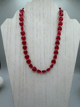 Load image into Gallery viewer, This ruby red heart-shaped glass beaded necklace features a shimmery, translucent finish and a lobster claw clasp. Measurements: Necklace is 18 1/2" in length