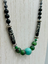Load image into Gallery viewer, This necklace boasts a diverse selection of natural bead materials, including ruby zoisite, black and snowflake obsidian stones, plus turquoise magnesite, bone, glass and metal beads. This variety of sizes, shapes, textures and colors will make this necklace stand out. Measurements: Necklace - 23" in length
