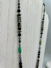 Load image into Gallery viewer, This necklace boasts a diverse selection of natural bead materials, including ruby zoisite, black and snowflake obsidian stones, plus turquoise magnesite, bone, glass and metal beads. This variety of sizes, shapes, textures and colors will make this necklace stand out. Measurements: Necklace - 23" in length