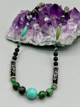 Load image into Gallery viewer, This necklace boasts a diverse selection of natural bead materials, including ruby zoisite, black and snowflake obsidian stones, plus turquoise magnesite, bone, glass and metal beads. This variety of sizes, shapes, textures and colors will make this necklace stand out. Measurements: Necklace - 23" in length
