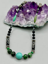 Load image into Gallery viewer, This necklace boasts a diverse selection of natural bead materials, including ruby zoisite, black and snowflake obsidian stones, plus turquoise magnesite, bone, glass and metal beads. This variety of sizes, shapes, textures and colors will make this necklace stand out. Measurements: Necklace - 23" in length