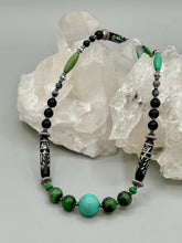 Load image into Gallery viewer, This necklace boasts a diverse selection of natural bead materials, including ruby zoisite, black and snowflake obsidian stones, plus turquoise magnesite, bone, glass and metal beads. This variety of sizes, shapes, textures and colors will make this necklace stand out. Measurements: Necklace - 23" in length