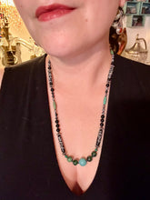 Load image into Gallery viewer, This necklace boasts a diverse selection of natural bead materials, including ruby zoisite, black and snowflake obsidian stones, plus turquoise magnesite, bone, glass and metal beads. This variety of sizes, shapes, textures and colors will make this necklace stand out. Measurements: Necklace - 23" in length