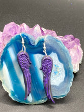 Load image into Gallery viewer, Sparkling dark purple angel wings earrings made of polymer clay.  These earrings are designed to face forward when worn instead of the front wings showing on the side.