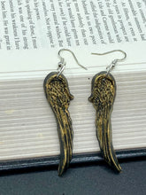 Load image into Gallery viewer, Sparkling gold tone angel wings earrings made of polymer clay. These earrings are designed to face forward when worn instead of the front wings showing on the side.