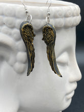 Load image into Gallery viewer, Sparkling gold tone angel wings earrings made of polymer clay. These earrings are designed to face forward when worn instead of the front wings showing on the side.