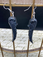Load image into Gallery viewer, Chrome-colored silver angel wings earrings crafted with polymer clay. Featuring a construction designed to ensure the front wings face forward when worn.
