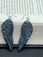 Load image into Gallery viewer, Chrome-colored silver angel wings earrings crafted with polymer clay. Featuring a construction designed to ensure the front wings face forward when worn.