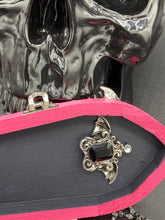 Load image into Gallery viewer, This unique handmade Pink Spooky Glam Wood Coffin Ring Box offers a statement piece for your witchy home decor. Its macabre collections boast a black and pink wood coffin with large shimmery bat embellishments and decorative black crystals around the exterior. Open up the box to find a bright turquoise mandala fabric and a tiny black crystal bat decoration for a truly eerie feel.