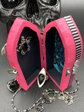 Load image into Gallery viewer, This unique handmade Pink Spooky Glam Wood Coffin Ring Box offers a statement piece for your witchy home decor. Its macabre collections boast a black and pink wood coffin with large shimmery bat embellishments and decorative black crystals around the exterior. Open up the box to find a bright turquoise mandala fabric and a tiny black crystal bat decoration for a truly eerie feel.