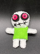Load image into Gallery viewer, Mini Lime Green And White Voodoo Doll stands at 3 1/2" in height. Torso is lime green with arms, legs and head is all white. He has dark red buttons for eyes. Adorable but with a dash of creepy.