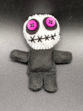 Load image into Gallery viewer, Creepy black and purple Voodoo Doll stands tall at 3 3/8" in height. He’s all black like a shadow but has a round white head. Bright purple buttons for eyes are perfect to see you better with.
