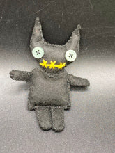 Load image into Gallery viewer, Black Devil Voodoo Doll has yellow mouth and cute little black horns of course, white buttons for eyes: 3 3/8" in height