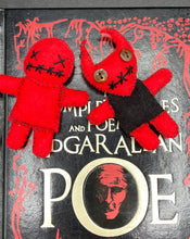Load image into Gallery viewer, Fire engine red Voodoo Doll has black “X” for eyes and mouth, so he’s kinda plain but still creepy: 3 3/8" in height. Red Devil Voodoo Doll stands at 4" in height. He has a black torso and red arms and legs and a red head with horns of course. He also has a black sowed shut mouth, Oh my, and brown button eyes.