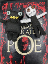Load image into Gallery viewer, Skinny black and white Voodoo Doll stands at 3 7/8" in height. Black torso and legs with white arm and head. Stylish brown buttons for eyes, but his lips are sowed shut of course. Black Devil Voodoo Doll has yellow mouth and cute little black horns of course, white buttons for eyes: 3 3/8" in height.