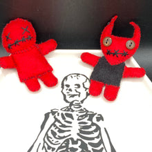 Load image into Gallery viewer, Fire engine red Voodoo Doll has black “X” for eyes and mouth, so he’s kinda plain but still creepy: 3 3/8" in height. Red Devil Voodoo Doll stands at 4" in height. He has a black torso and red arms and legs and a red head with horns of course. He also has a black sowed shut mouth, Oh my, and brown button eyes.