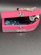 Load image into Gallery viewer, Black and white Voodoo Doll stands at 3" in height. He has an all black body with a white round head. Bulging lime green button eyes and sowed shut mouth to give him a little creepy face of course.