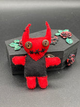Load image into Gallery viewer, Red Devil Voodoo Doll stands at 4" in height. He has a black torso and red arms and legs and a red head with horns of course. He also has a black sewed shut mouth, Oh my, and brown button eyes.
