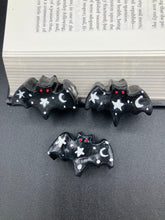 Load image into Gallery viewer, Cute and spooky magnet design to adorn your refrigerator, lockers, workstation, toolbox, or dishwasher. This hand-sculpted clay bat statuette all black with white stars to recreate a starry night sky. H 1” x W 2” x D 1/2”