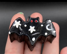Load image into Gallery viewer, Cute and spooky magnet design to adorn your refrigerator, lockers, workstation, toolbox, or dishwasher. This hand-sculpted clay bat statuette all black with white stars to recreate a starry night sky. H 1” x W 2” x D 1/2”