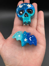 Load image into Gallery viewer, Ideal magnet design to adorn your refrigerator, lockers, workstation, toolbox, or dishwasher. This hand-sculpted clay skull and bat statuette boasts stunning ombre coloration, transitioning from dark blue to light blue to recreate the breathtaking look of a starry night sky.