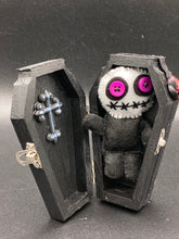 Load image into Gallery viewer, Creepy black and purple Voodoo Doll stands tall at 3 3/8" in height. He’s all black like a shadow but has a round white head. Bright purple buttons for eyes are perfect to see you better with.