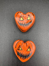 Load image into Gallery viewer, Perfect cute and spooky Halloween item to add to your fridge, locker, cubicle or toolbox. This hand-crafted bright orange heart-shaped magnet showcases a Jack o Lantern inspired design. Measurements: H 1 1/2” x W 1 5/8” x D 1/2”